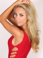 Divine blonde alluring vixen babe aneta teases in a skimpy tight little red dress.