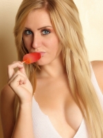 Stunning Ashley Vallone teases with her oral skills on a popsicle in rainbow stripped socks