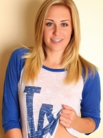 Blonde tease Ashley Vallone shows off in a LA shirt and super tight jean shorts